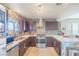 Updated kitchen featuring granite countertops, stainless steel appliances, and mosaic tile backsplash at 433 Jubilation Dr, Las Vegas, NV 89145