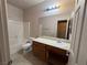 Clean bathroom with single vanity, toilet, and bathtub at 4419 S Glory Vine Ln, Pahrump, NV 89061