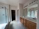 Double vanity bathroom with large mirror and glass shower at 4419 S Glory Vine Ln, Pahrump, NV 89061