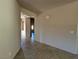 Bright hallway with tile flooring and neutral-toned walls at 4419 S Glory Vine Ln, Pahrump, NV 89061