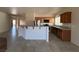 Open kitchen with granite countertops and breakfast bar at 4419 S Glory Vine Ln, Pahrump, NV 89061