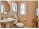 Clean and updated half bathroom with a pedestal sink and modern fixtures at 4705 Bersaglio St, Las Vegas, NV 89135