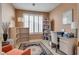 Well-lit home office featuring built-in shelving and a workspace at 4705 Bersaglio St, Las Vegas, NV 89135