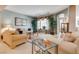 Bright living room with large windows and a neutral color palette at 4705 Bersaglio St, Las Vegas, NV 89135