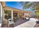 Large covered patio with seating and built-in grill at 4705 Bersaglio St, Las Vegas, NV 89135