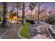 Landscaped backyard with a pool, spa, and lush greenery at 478 Spanish View Ln, Las Vegas, NV 89110