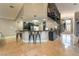 Gourmet kitchen with breakfast bar, modern appliances, and a spiral staircase at 478 Spanish View Ln, Las Vegas, NV 89110