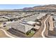 Aerial view of a beautiful community with modern homes and landscaping at 4973 Sandline Ct, Las Vegas, NV 89135