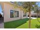 Landscaped backyard with artificial turf and a block wall at 4973 Sandline Ct, Las Vegas, NV 89135