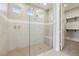 Spa-like bathroom with a large walk-in shower and a built-in bench at 4973 Sandline Ct, Las Vegas, NV 89135