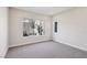 Bright bedroom with carpet flooring and large window offering natural light at 4973 Sandline Ct, Las Vegas, NV 89135