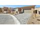 Single-story home with attached garage and landscaped yard at 4973 Sandline Ct, Las Vegas, NV 89135