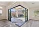 Bright Gathering room with sliding glass doors opening to the backyard at 4973 Sandline Ct, Las Vegas, NV 89135