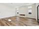 Living room featuring hardwood floors and a linear fireplace at 4973 Sandline Ct, Las Vegas, NV 89135