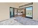 Open patio with glass doors leading to the kitchen and backyard at 4973 Sandline Ct, Las Vegas, NV 89135