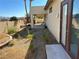 Backyard with gravel and desert landscaping, leading to a covered patio at 5016 Wayfaring Tree Ave, Las Vegas, NV 89131