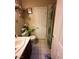 Well-lit bathroom with toilet, sink, and shower at 5016 Wayfaring Tree Ave, Las Vegas, NV 89131