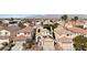 Aerial view of a residential neighborhood with tree lined streets and mountain views at 5028 Frozen Springs Ct, Las Vegas, NV 89130