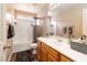 Bathroom featuring a shower-tub combination, vanity, and wood-look flooring at 5028 Frozen Springs Ct, Las Vegas, NV 89130