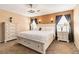 Primary bedroom featuring a modern ceiling fan, soft carpet, and white furnishings at 5028 Frozen Springs Ct, Las Vegas, NV 89130