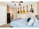 Bedroom with guitars on the wall, a ceiling fan, and neutral carpeting at 5028 Frozen Springs Ct, Las Vegas, NV 89130