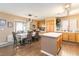 Open concept dining area and kitchen featuring wood floors and complementary countertops at 5028 Frozen Springs Ct, Las Vegas, NV 89130