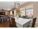 Dining room with wood floors and table, providing a view of the front yard at 5028 Frozen Springs Ct, Las Vegas, NV 89130