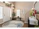 Bright foyer featuring a decorative rug, neutral walls, and tasteful decorations creating a welcoming entrance at 5028 Frozen Springs Ct, Las Vegas, NV 89130