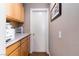 Hallway with counter space and cabinets for additional storage, beside a white door at 5028 Frozen Springs Ct, Las Vegas, NV 89130