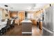 Spacious kitchen with stainless steel appliances, an island, and wood cabinetry offering a modern cooking space at 5028 Frozen Springs Ct, Las Vegas, NV 89130