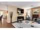 Well-lit living room with a fireplace, comfortable seating, and entertainment setup, ideal for Gathering time at 5028 Frozen Springs Ct, Las Vegas, NV 89130