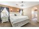 Relaxing main bedroom featuring neutral tones, an ensuite bath, and comfortable bedding at 5028 Frozen Springs Ct, Las Vegas, NV 89130