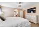 Main bedroom featuring plush carpet, modern lighting, and an ensuite bathroom at 5028 Frozen Springs Ct, Las Vegas, NV 89130