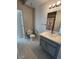 Clean bathroom with gray vanity and floral shower curtain at 5225 W Reno Ave # 129, Las Vegas, NV 89118