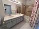 Featuring a full tub and shower with double sink vanity at 5225 W Reno Ave # 129, Las Vegas, NV 89118