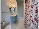 Bathroom with vanity, shower, and floral shower curtain at 5225 W Reno Ave # 129, Las Vegas, NV 89118