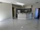 Well-lit kitchen features gray cabinets, modern appliances, and an open layout at 5225 W Reno Ave # 129, Las Vegas, NV 89118