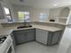 Kitchen with gray cabinets, quartz countertops, and stainless steel sink at 5225 W Reno Ave # 129, Las Vegas, NV 89118