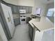 Updated kitchen featuring gray cabinets and white appliances at 5225 W Reno Ave # 129, Las Vegas, NV 89118