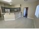 Modern kitchen with gray cabinets, white appliances, and quartz countertops at 5225 W Reno Ave # 129, Las Vegas, NV 89118