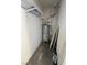 Small laundry room with water heater and shelving at 5225 W Reno Ave # 129, Las Vegas, NV 89118