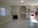 Living room with fireplace and access to patio at 5225 W Reno Ave # 129, Las Vegas, NV 89118