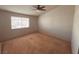 Bright bedroom with ceiling fan and large window at 5350 Rod Ct # 202, Las Vegas, NV 89122