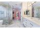 Luxurious bathroom with marble flooring, a soaking tub, and a glass shower at 5992 Genovese Ave, Las Vegas, NV 89141