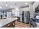 Modern kitchen with stainless steel appliances and white cabinets at 5992 Genovese Ave, Las Vegas, NV 89141