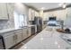 Modern kitchen with stainless steel appliances and white cabinets at 5992 Genovese Ave, Las Vegas, NV 89141