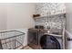 Laundry room with washer, dryer, and additional shelving at 5992 Genovese Ave, Las Vegas, NV 89141