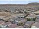 Aerial view of a community showing residential homes with mountain views at 6178 Pisan Ln, Las Vegas, NV 89148