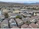 A panoramic view showcasing homes in a community near a park and mountains in the distance at 6178 Pisan Ln, Las Vegas, NV 89148