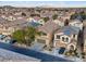 A beautiful aerial shot showing a residential neighborhood filled with desert landscaping and many two-story stucco homes at 6178 Pisan Ln, Las Vegas, NV 89148